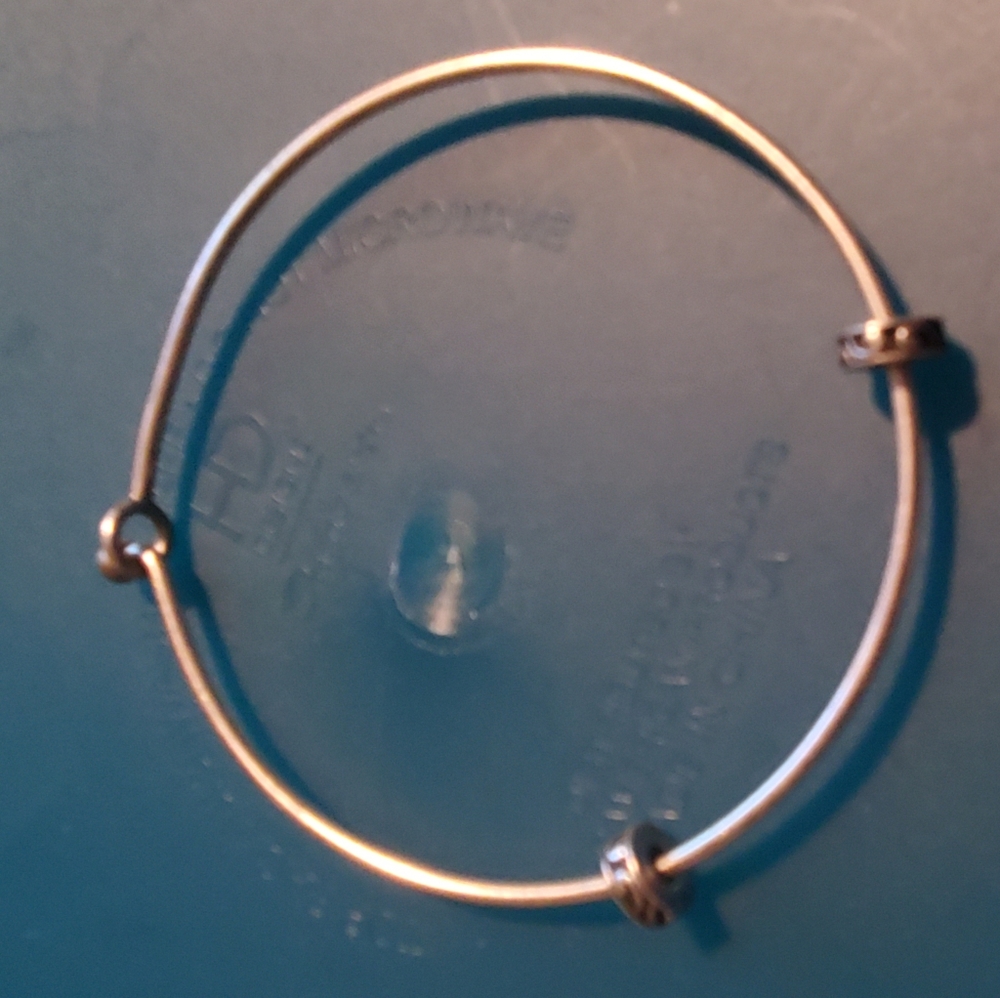 Charm bracelet has stoppers